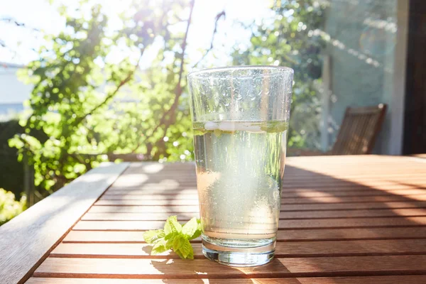 Cool drink with mint and ice on table — Stock Photo, Image