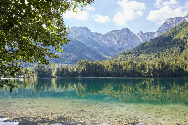 Refections on the water of Vorder Langbathsee in Austria