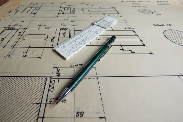 Old technical plan with pen on old table