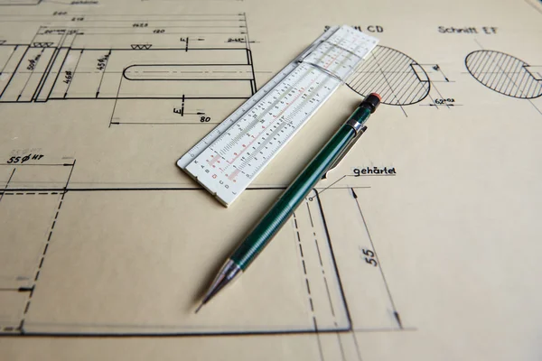 Old technical plan with pen on old table