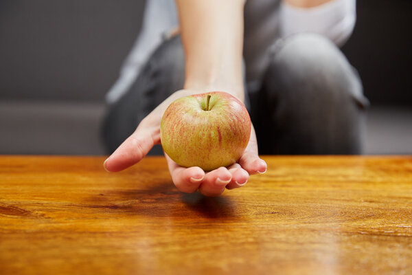 Woman holding an apple