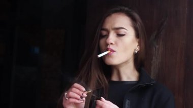 https://st2.depositphotos.com/3565043/10206/v/380/depositphotos_102065274-stock-video-beautiful-woman-smokes-a-cigarette.jpg