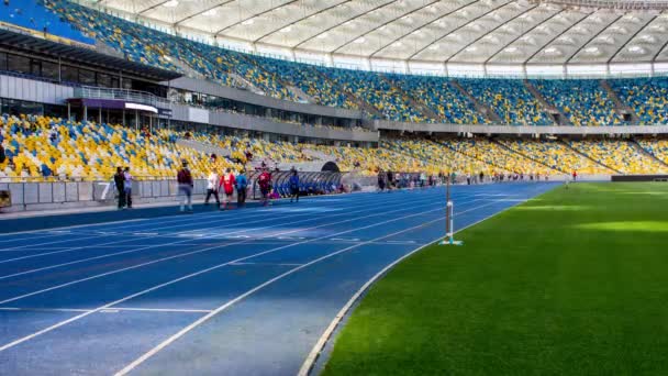 People go to The Stadium. Sports Competitions in athletics. 4k. Time lapse. — Stock Video