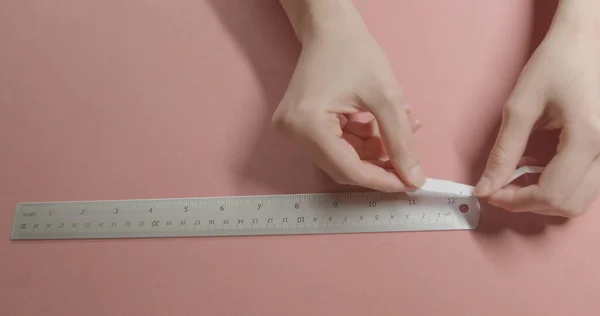 girl doing measurement for ring size