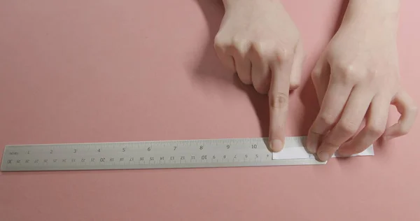 girl doing measurement for ring size