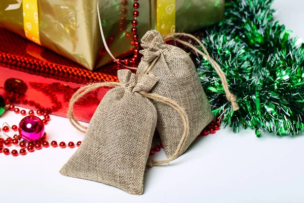 Two Linen Bags Gift Boxes Christmas Decorations Background Studio Shot — Stock Photo, Image