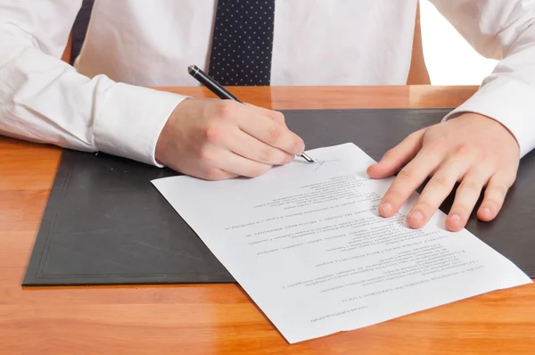Businessman signing documents Royalty Free Stock Photos