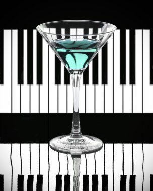Blue cocktail on a black and white piano background clipart