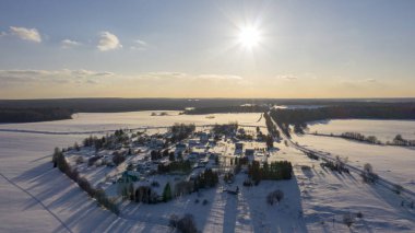 gorgeous winter evening over the village from a birds eye view filmed with a drone