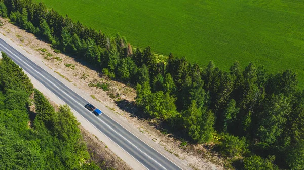 Automobile travel across Russia. A view from a height of a car moving along the road.