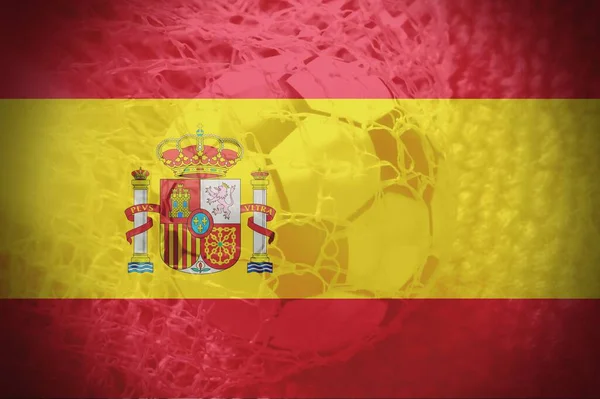 Spanish Flag with a soccer ball inside the net as background. Concept of Spanish soccer team.
