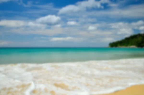 Blur tropical beach with sun light abstract background. — Stock Photo, Image