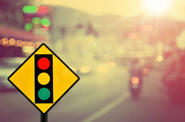 Traffic sign,traffic light sign on blur traffic road — Stock Photo, Image