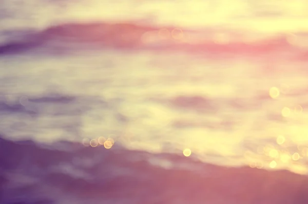 Praia de Blur com luz do sol bokeh fundo abstrato . — Fotografia de Stock