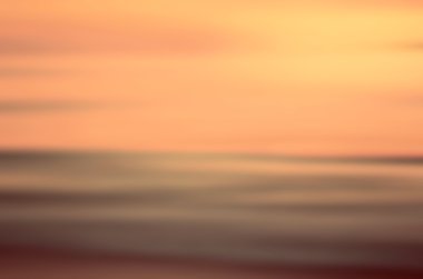 Hareket bulanıklığı tropikal günbatımı plaj arka plan. 