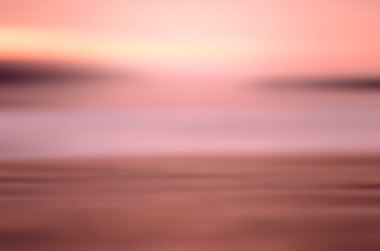 Hareket bulanıklığı tropikal günbatımı plaj arka plan. 