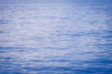 Tropikal günbatımı plaj ile bokeh güneş ışık dalga arka plan bulanıklık. Seyahat kavramı. 