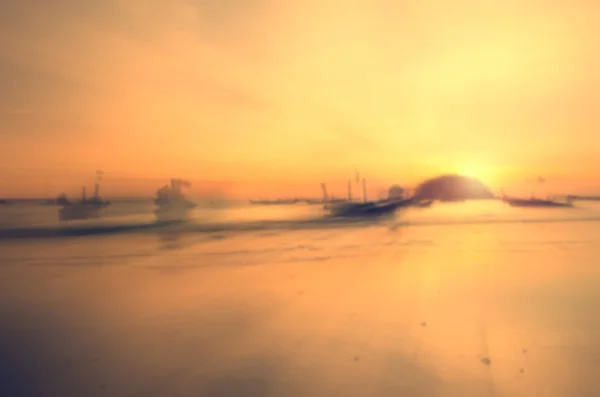 Bewegung verschwimmen tropischen Sonnenuntergang Strand abstrakten Hintergrund. — Stockfoto