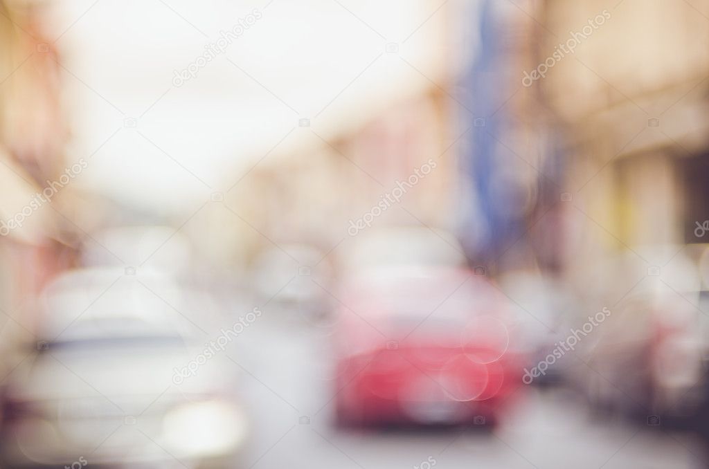 Blur traffic road with old building abstract background. 