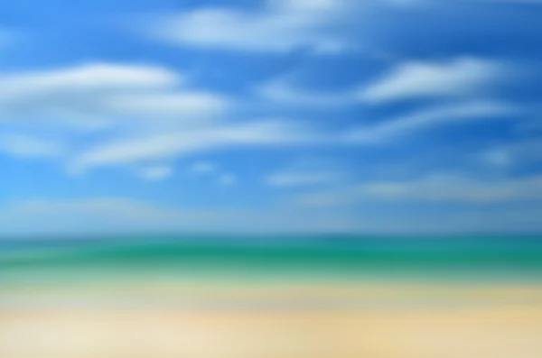 Blur tropical beach with sun light abstract background. — Stock Photo, Image