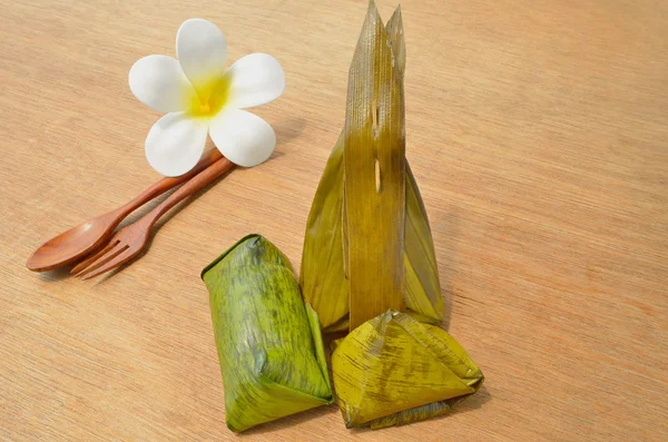 Thai dessert sticky rice wrapped in banana leaf — Stock Photo, Image