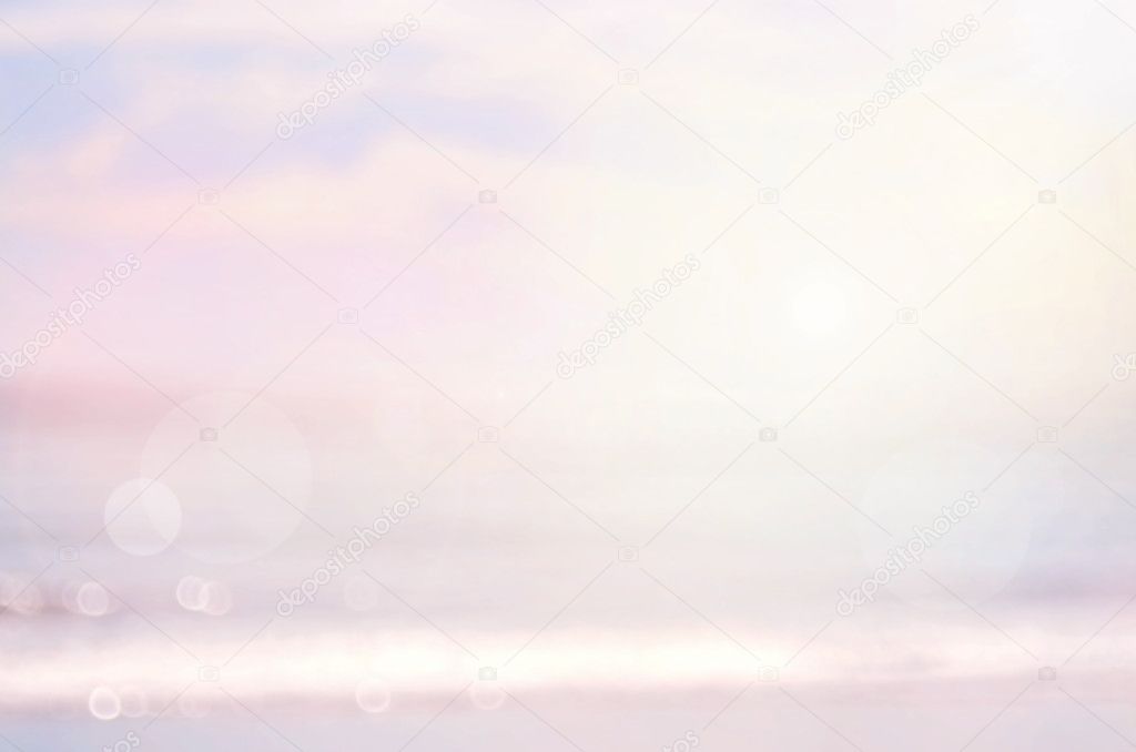 Blur beach with blue sky abstract background.