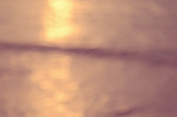 Oskärpa bokeh våg stranden abstrakt bakgrund — Stockfoto