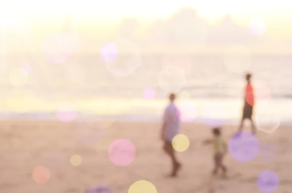 Blur children playing on tropical sunset beach abstract background. — Stock Photo, Image