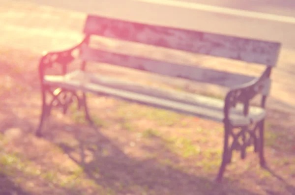 Blur outdoor chair in nature park abstract background.