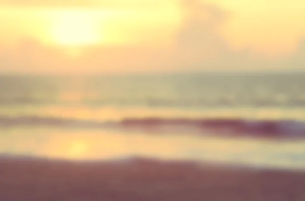 Розмитий захід сонця пляж абстрактний фон . — стокове фото