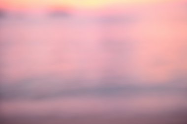 Tropikal günbatımı plaj ile bokeh güneş ışık dalga arka plan bulanıklık.