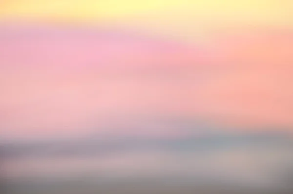 Sfocatura tropicale tramonto onda spiaggia astratto sfondo . — Foto Stock