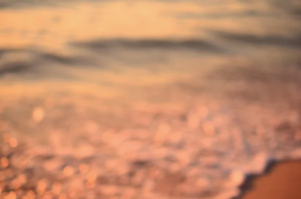 Verschwimmen tropischen Sonnenuntergang Strand abstrakten Hintergrund. — Stockfoto