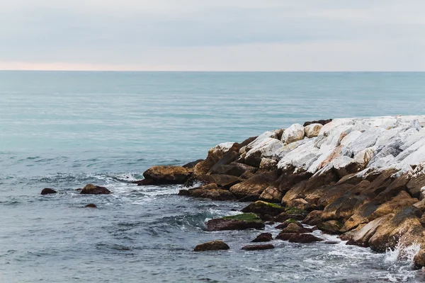 The sea rocks in Marina di Pisa. Italy — Stock Photo, Image