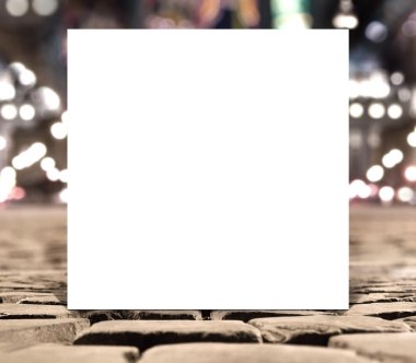 Blank white square paper template banner on the road pavement bricks with unfocused background clipart