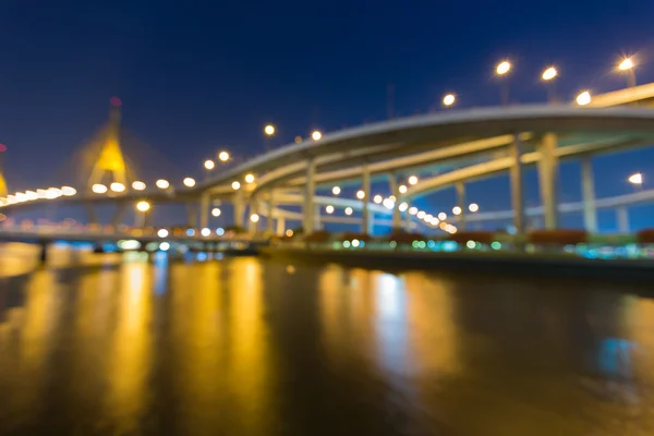 Blurred bokeh lights, suspension bridge — Stock Photo, Image