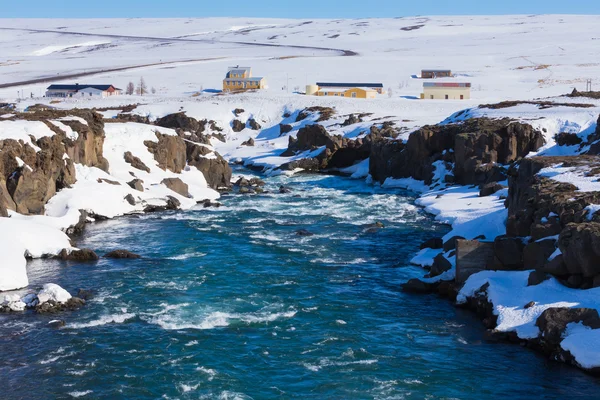 Frozen waterfall with clear blue water — Stock Photo, Image