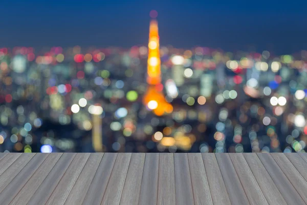 Opening wooden floor, abstract blurred bokeh Tokyo cityscape — Stock Photo, Image