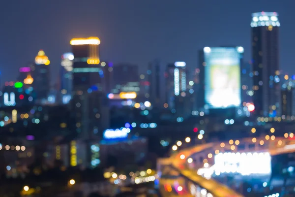 Blurred bokeh lights, Highway interchanged and city downtown background after sunset — Stock Photo, Image