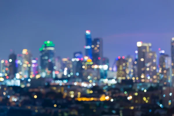 Luci sfocate grande città centro, astratto bokeh sfondo — Foto Stock