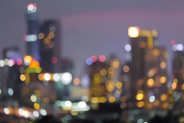 Resumen luces borrosas ciudad centro de fondo — Foto de Stock