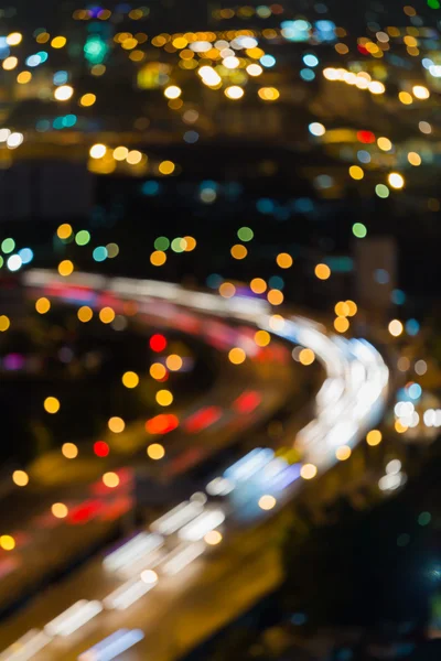 Nätter suddiga lampor, staden highway böjda — Stockfoto