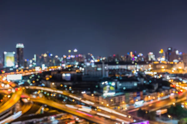 Aerial view, abstract blurred lights city downtown background, night view — Stock Photo, Image