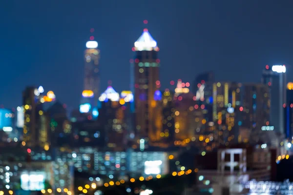 Bokeh borrosa luces vista nocturna, torre de la oficina de la ciudad —  Fotos de Stock