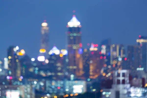 Blurred bokeh lights building tower — Stock Photo, Image