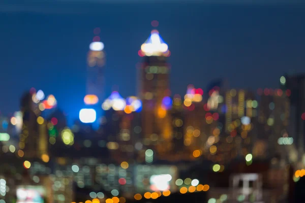Rozmazané světla měst bokeh za soumraku — Stock fotografie
