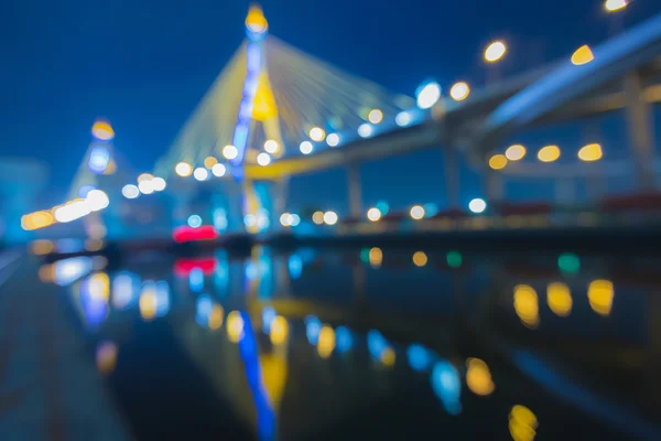 Out of focus bokeh lights of Phomipoon Bridge with water reflextion — Stock Photo, Image