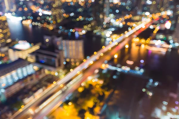 Blurred bokeh lights city bridge cross river — Stock Photo, Image