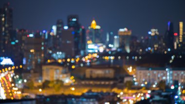 Night view, blurred bokeh lights city downtown at twilight clipart