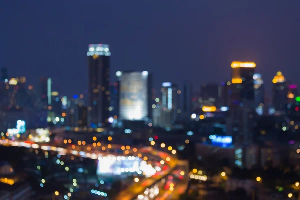 Noche borrosa luces ciudad centro abstracto fondo — Foto de Stock